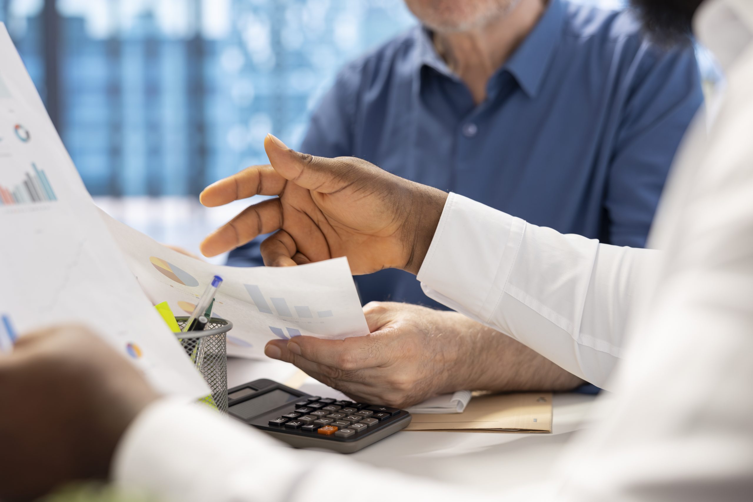 Business owners consulting with a tax advisor about elections and financial planning